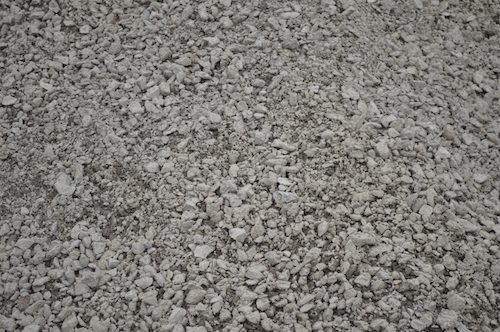 Granular A crushed limestone aggregate — blended particle sizes from 3/4 inch down to fine dust, used as paving base in Hamilton Ontario