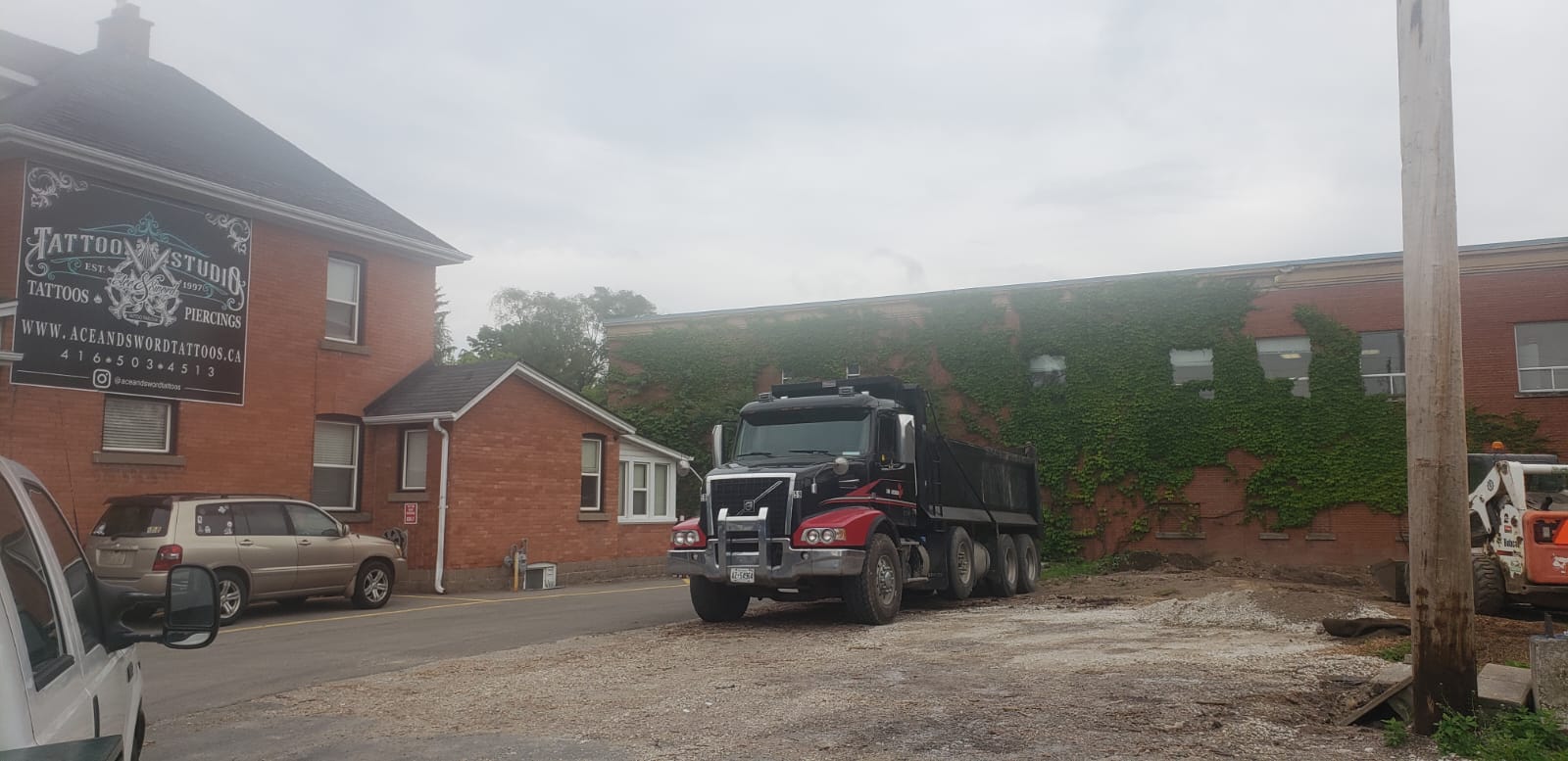 Triaxle dump truck delivering Granular A aggregate for paving in Hamilton Ontario